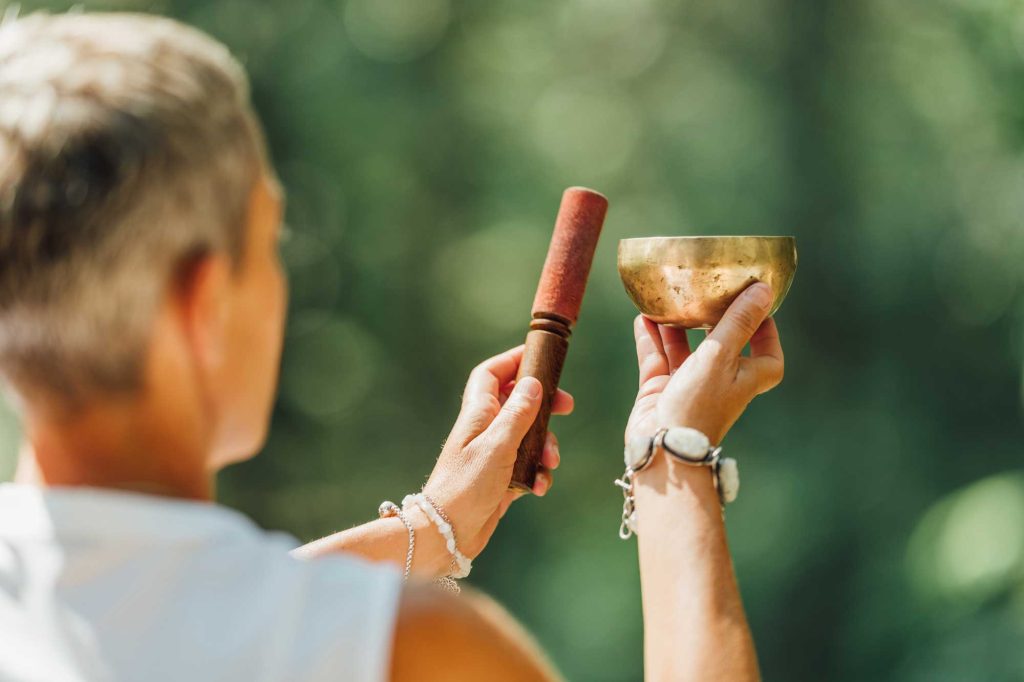 A singing bowl ritual creating a quiet space for sacred listening and gathered attention